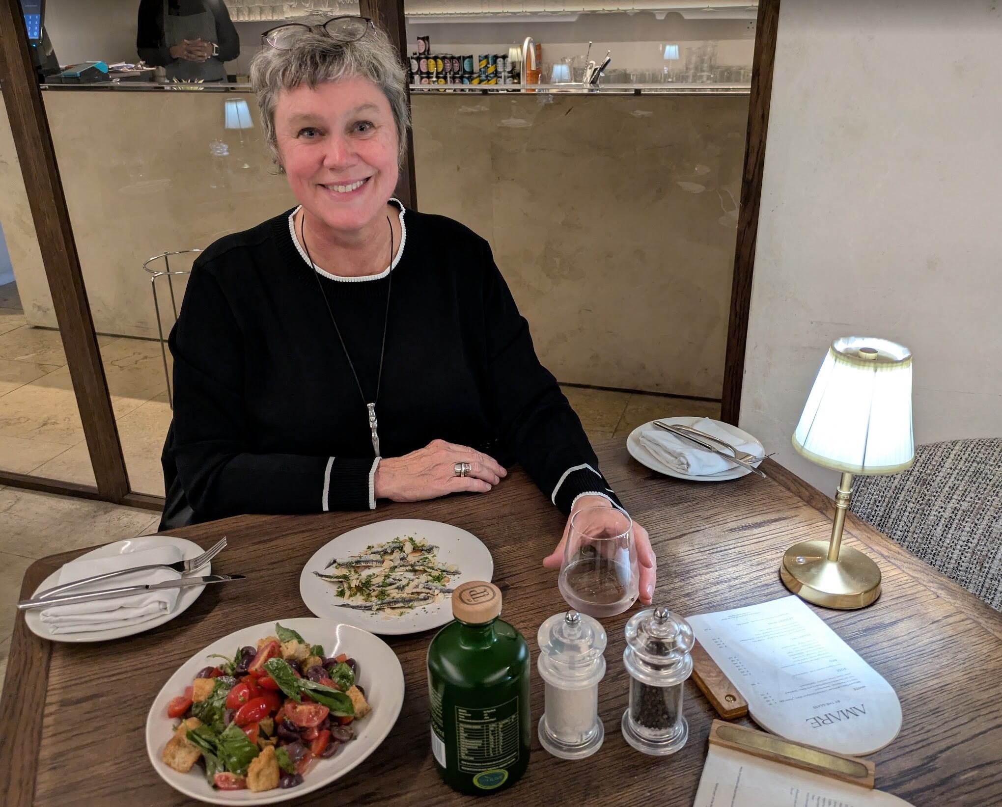 Talented cook Leigh Sumner with the grilled anchovies and panzanella salad starters at Amare.